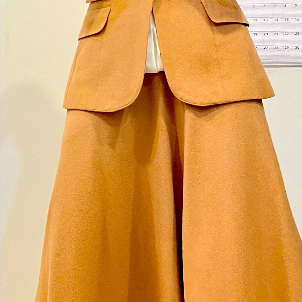 Camel two piece wool suit. Skirt w/pockets and fitted blazer